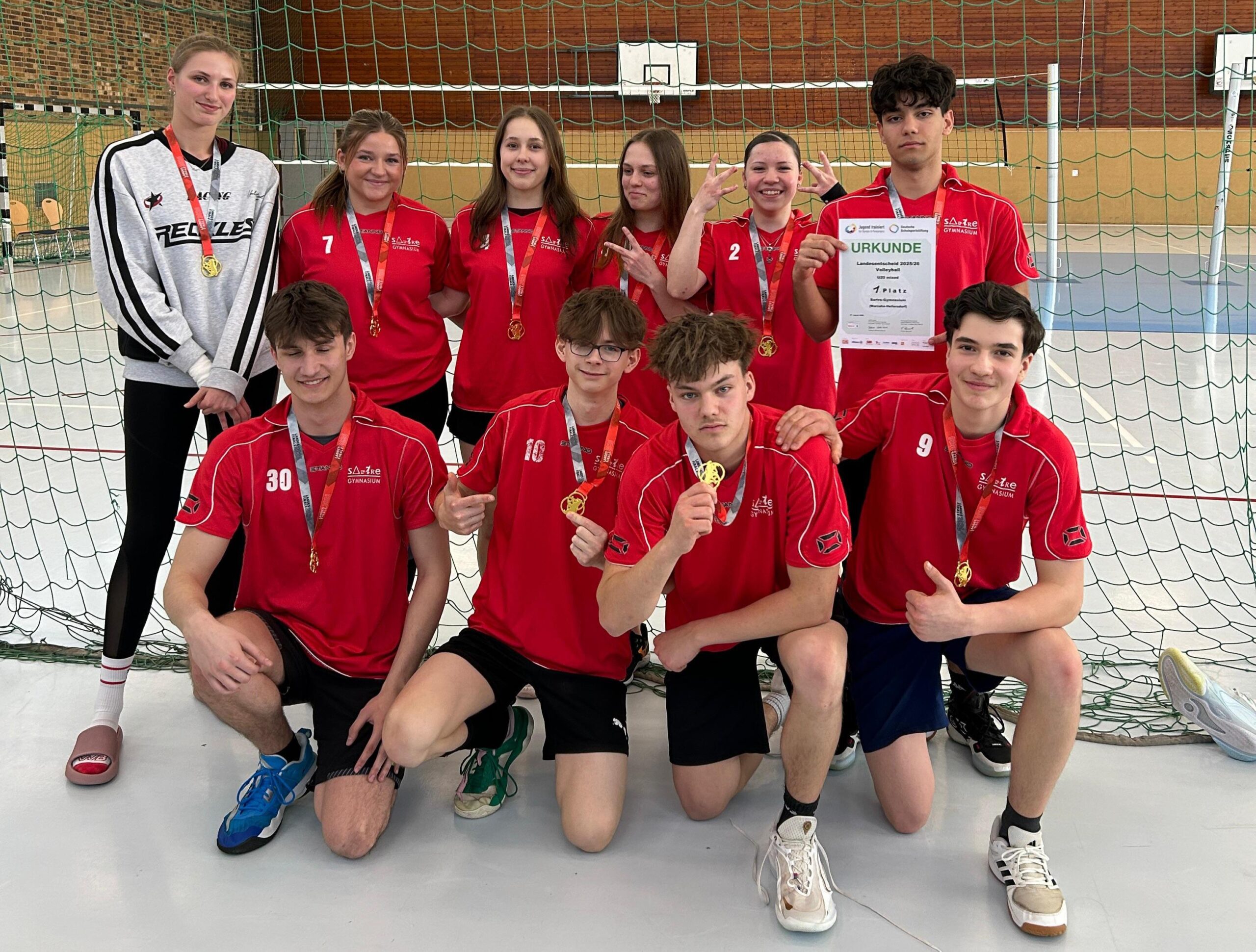 Olympia-Sportteam mit Goldmedaillen